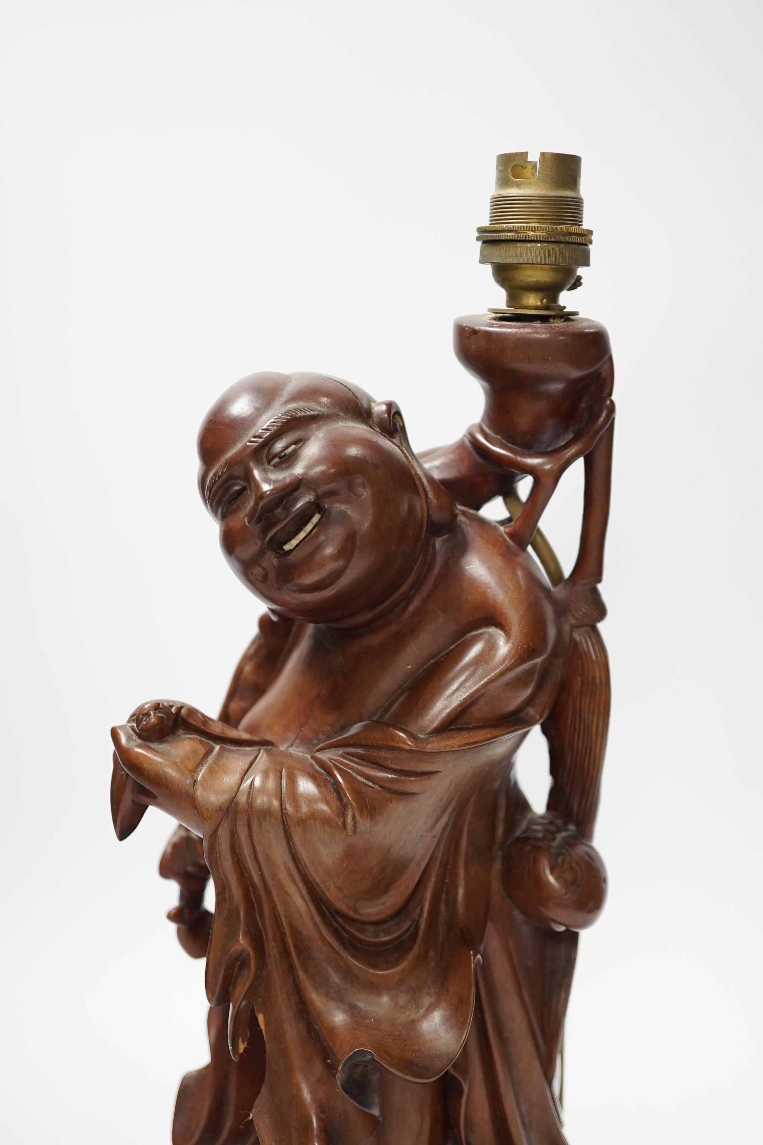 A Chinese carved hardwood figural table lamp base 42cm high